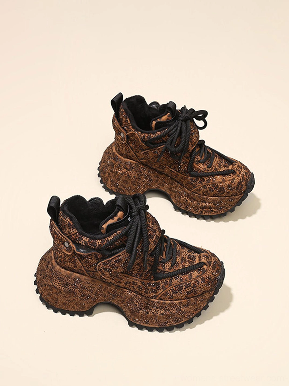 Side flat lay of brown rhinestone leopard platform sneakers showing plush fuzzy lining and chunky sole