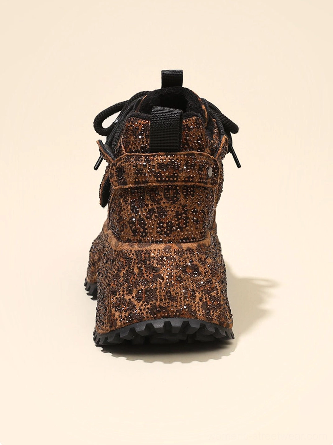 Rear view of brown rhinestone leopard platform sneakers showing ankle strap heel pull tab and rugged outsole