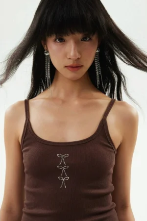 Close-up of brown ribbed camisole tank top with square neckline and three bow rhinestone decorations
