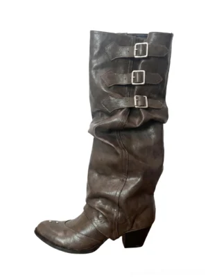 Vintage brown ruched buckle western knee-high boots with triple metal straps, pointed toe, and stacked low heel