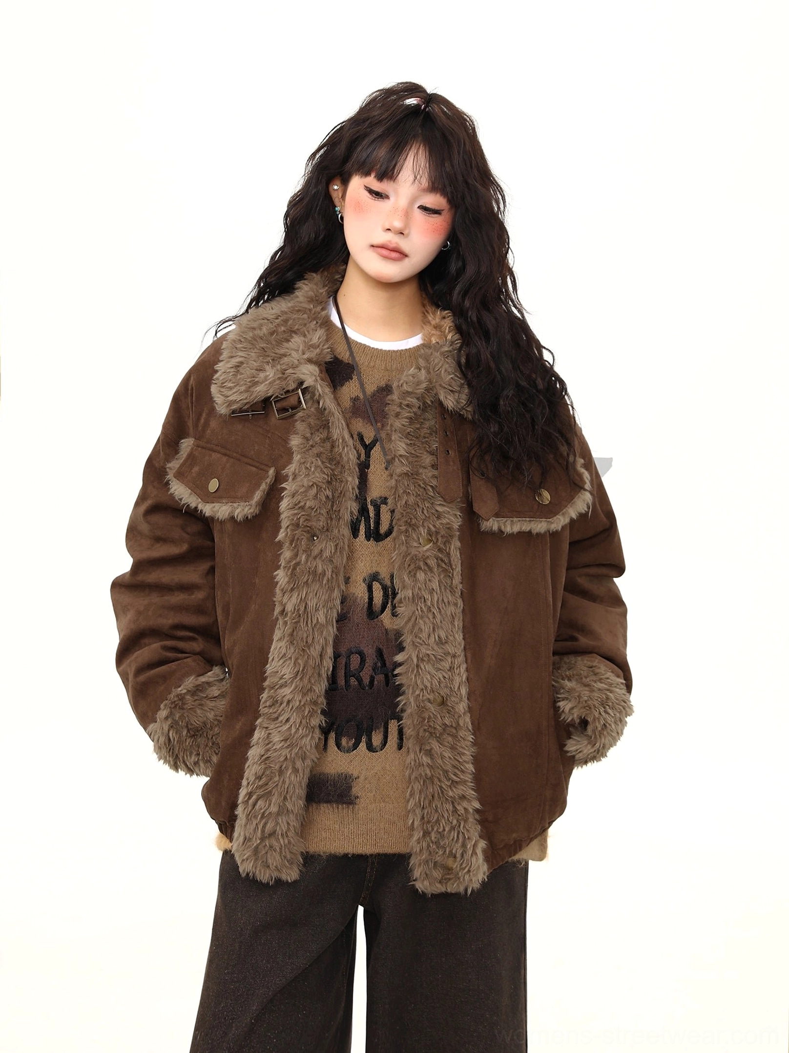 Front detail of a brown shearling aviator jacket with adjustable buckle collar, fuzzy front placket, and flap chest pockets