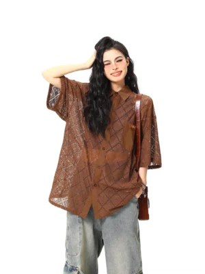 Brown sheer geometric lace oversized short sleeve button-up shirt front three-quarter view on female model