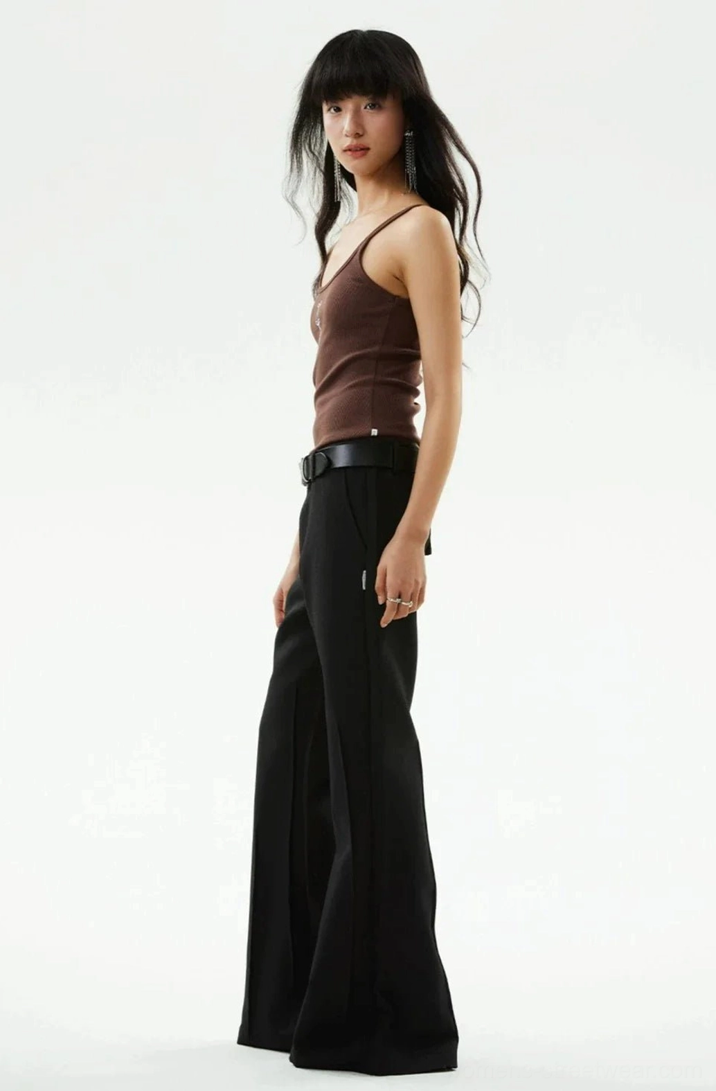 Side profile of brown slim-fit ribbed tank top with delicate spaghetti straps and textured knit fabric