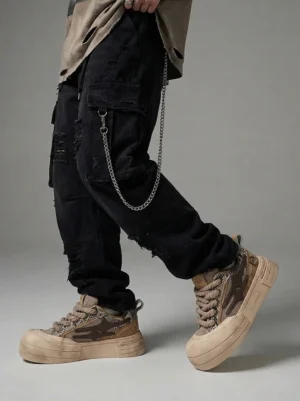 Brown smiley lightning platform sneakers styled with black ripped cargo pants and chain accessory for streetwear outfit
