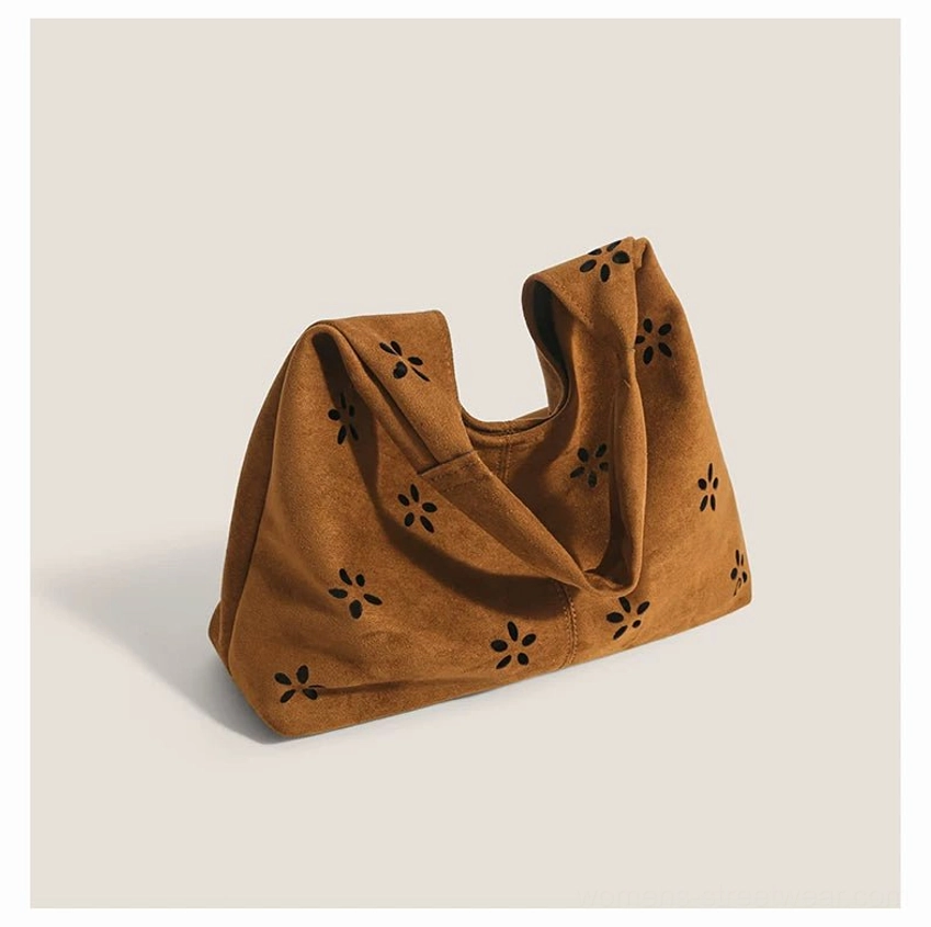 Soft brown suede-effect daisy cutout hobo tote bag folded side profile view