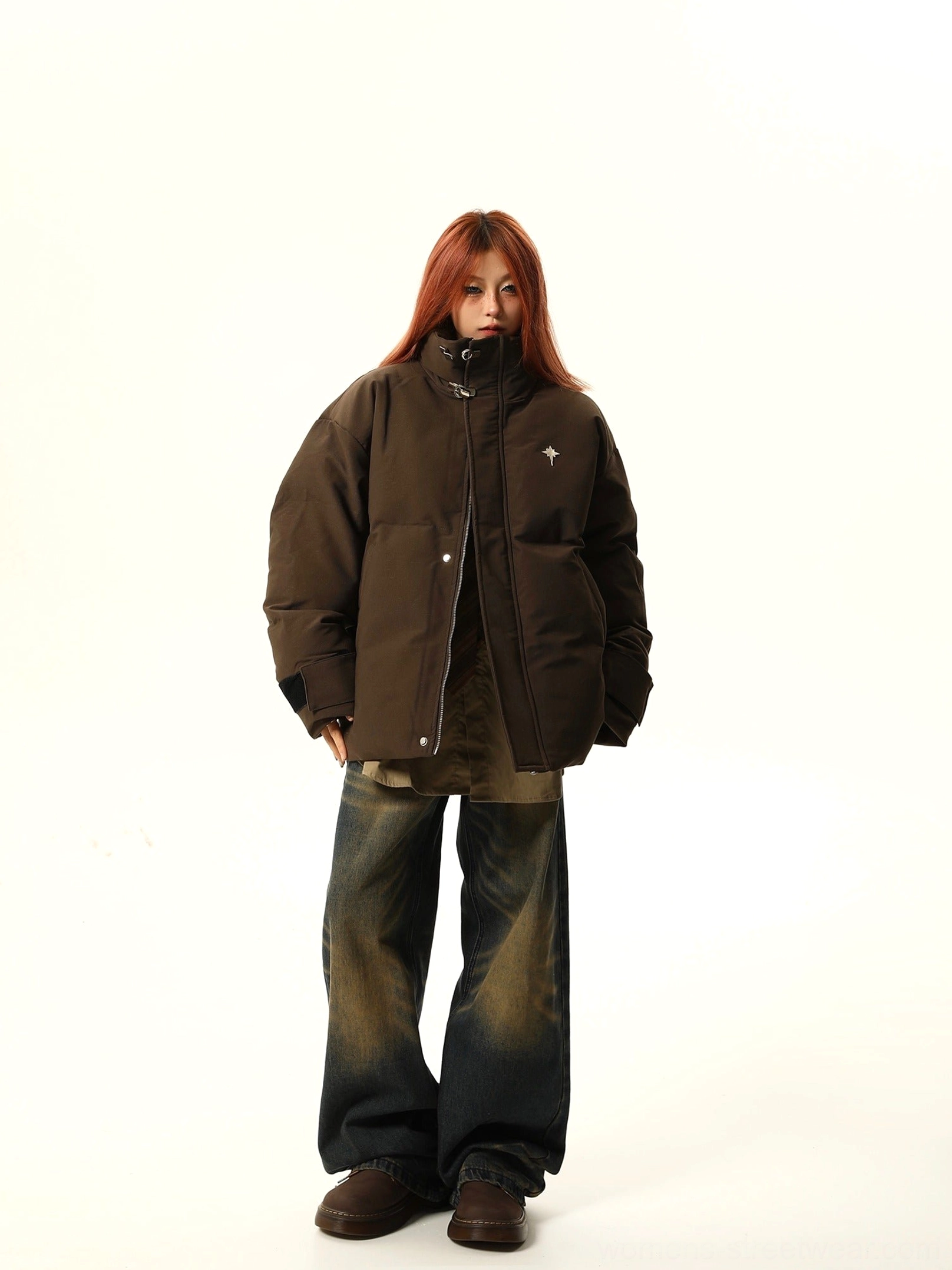 Brown star embroidered oversized puffer jacket zipped up with wide leg vintage jeans