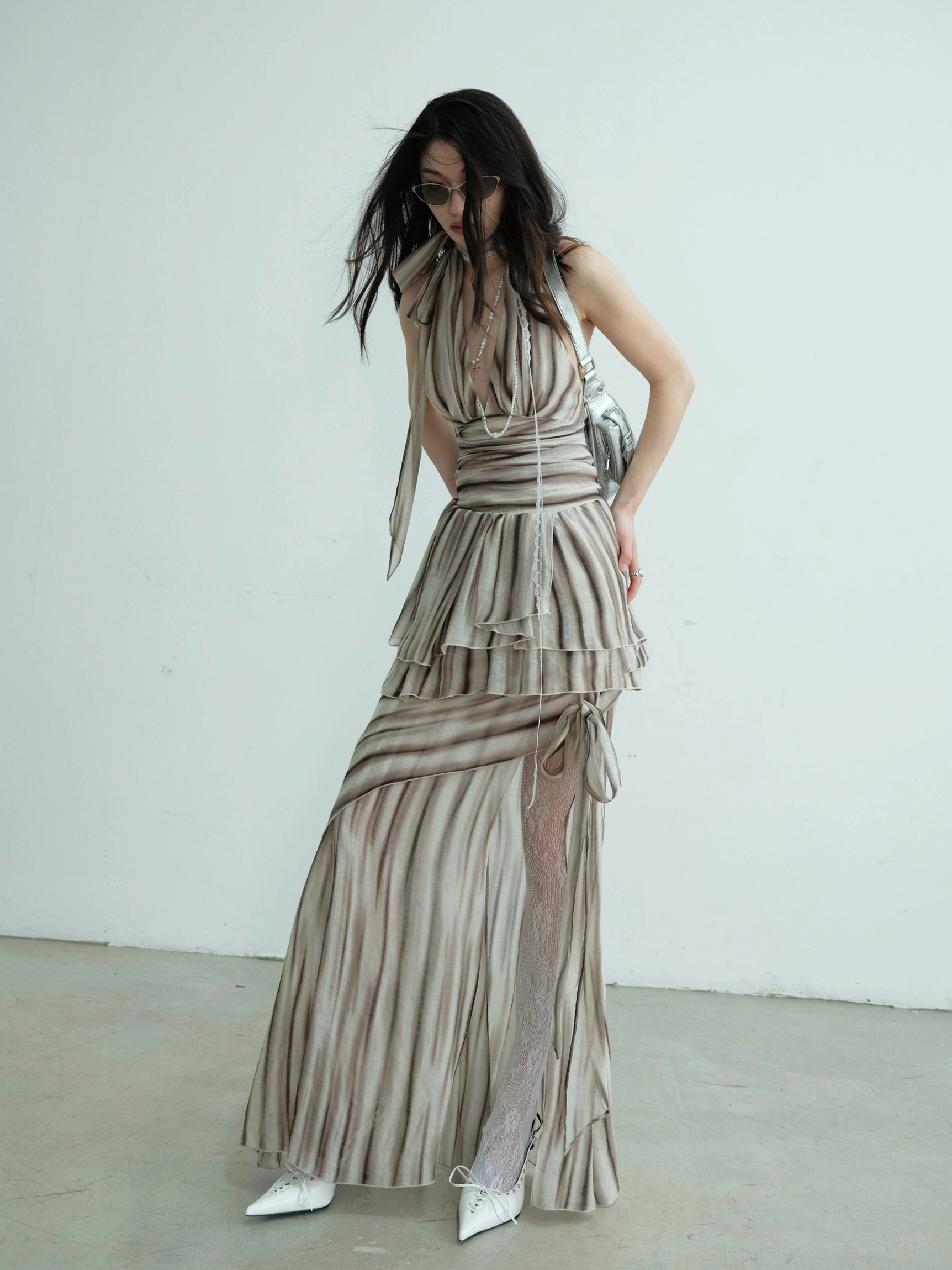 Brown striped halter dress set with layered ruched waist, high side split, sheer stockings, and flowing floor-length skirt in a side view