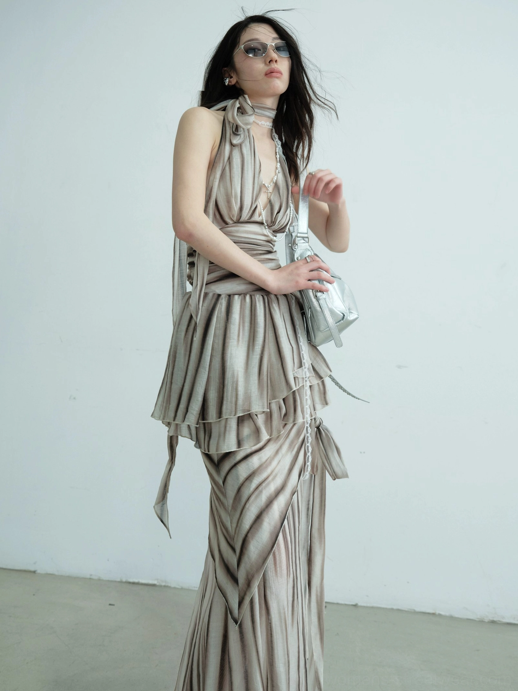 Brown striped halter two-piece dress set with detachable sash, ruched waist, draped skirt details, sunglasses, and silver handbag