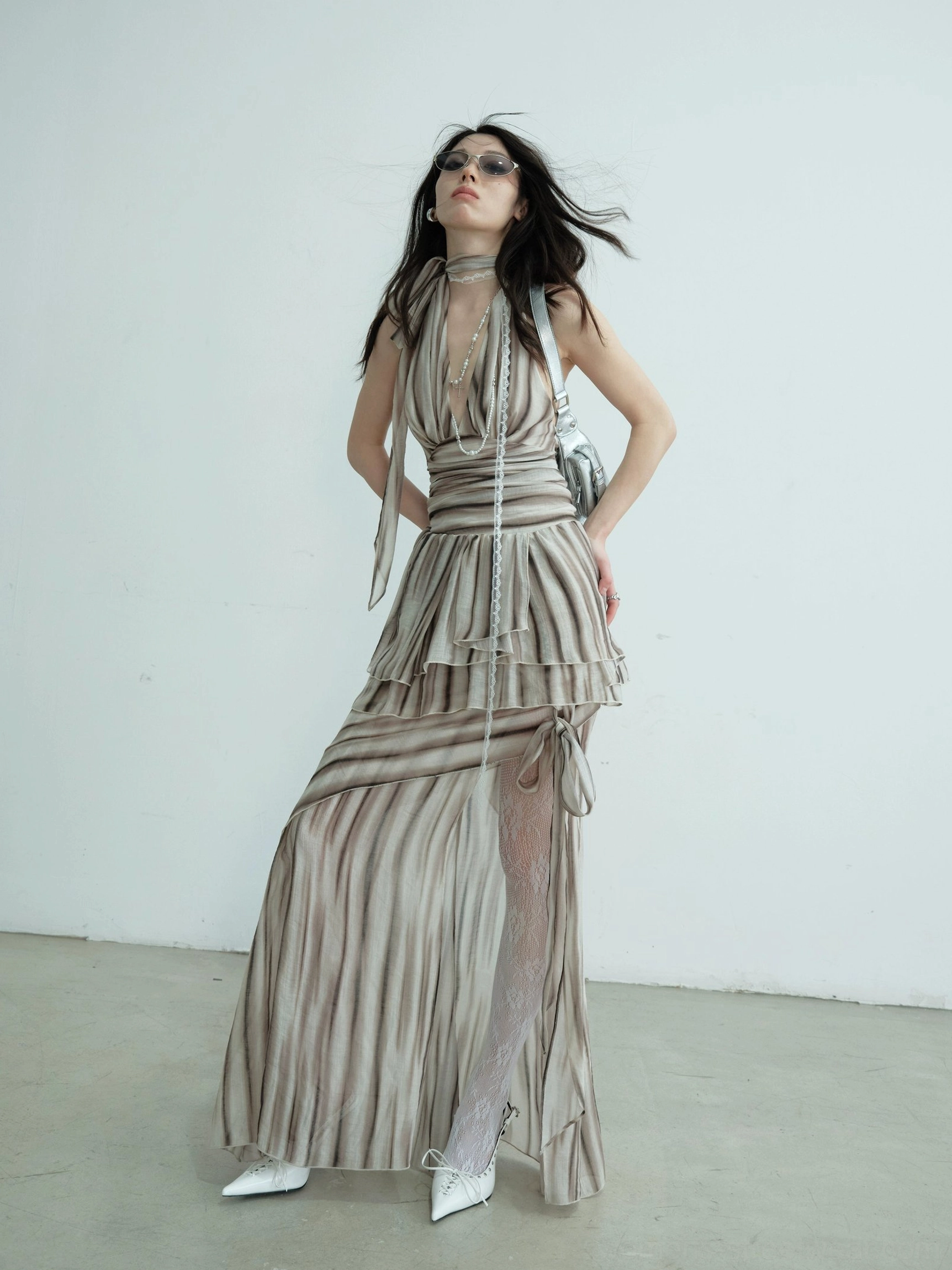 Brown striped halter two-piece dress with ruched ruffled waist, high side split, sheer stockings, and full-length flowing skirt