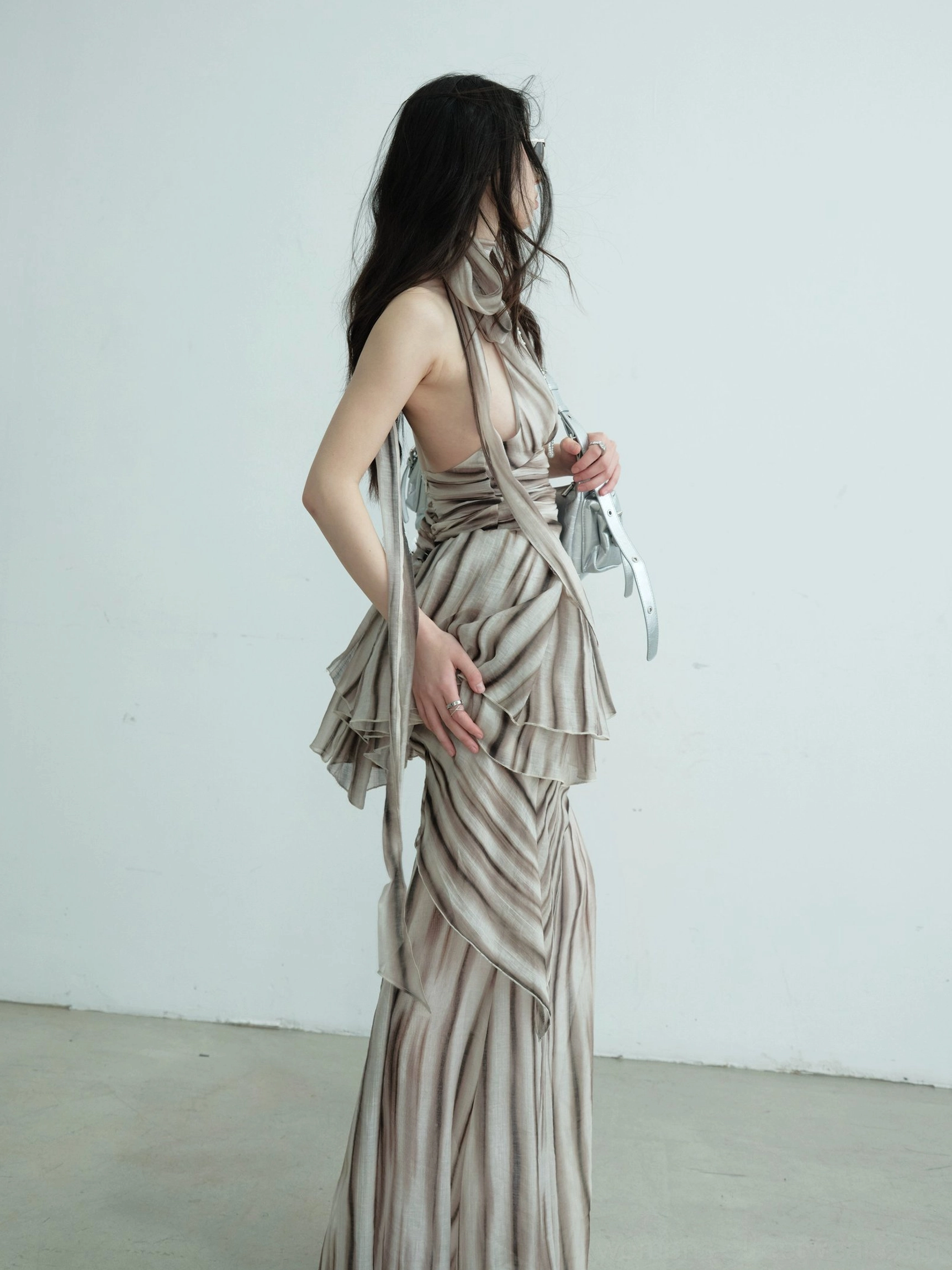 Brown striped halter two-piece dress set with ruched waist and flowing floor-length skirt styled for a modern Seoul streetwear outfit