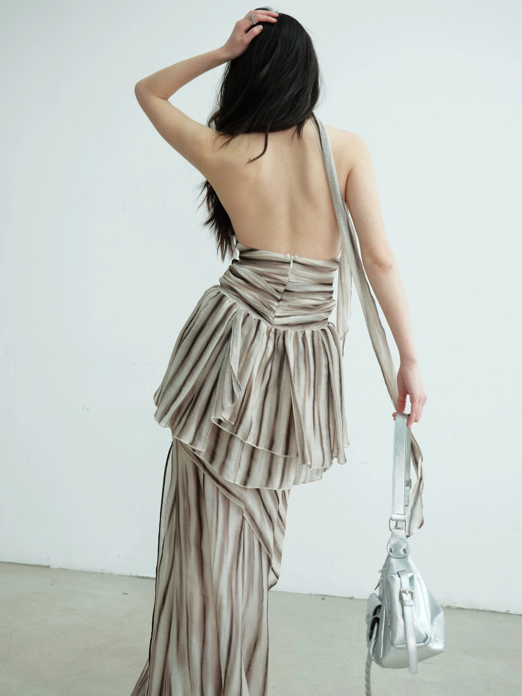 Brown striped halter vest and matching maxi skirt seen from the back, highlighting the bare-back design and layered ruched waistband