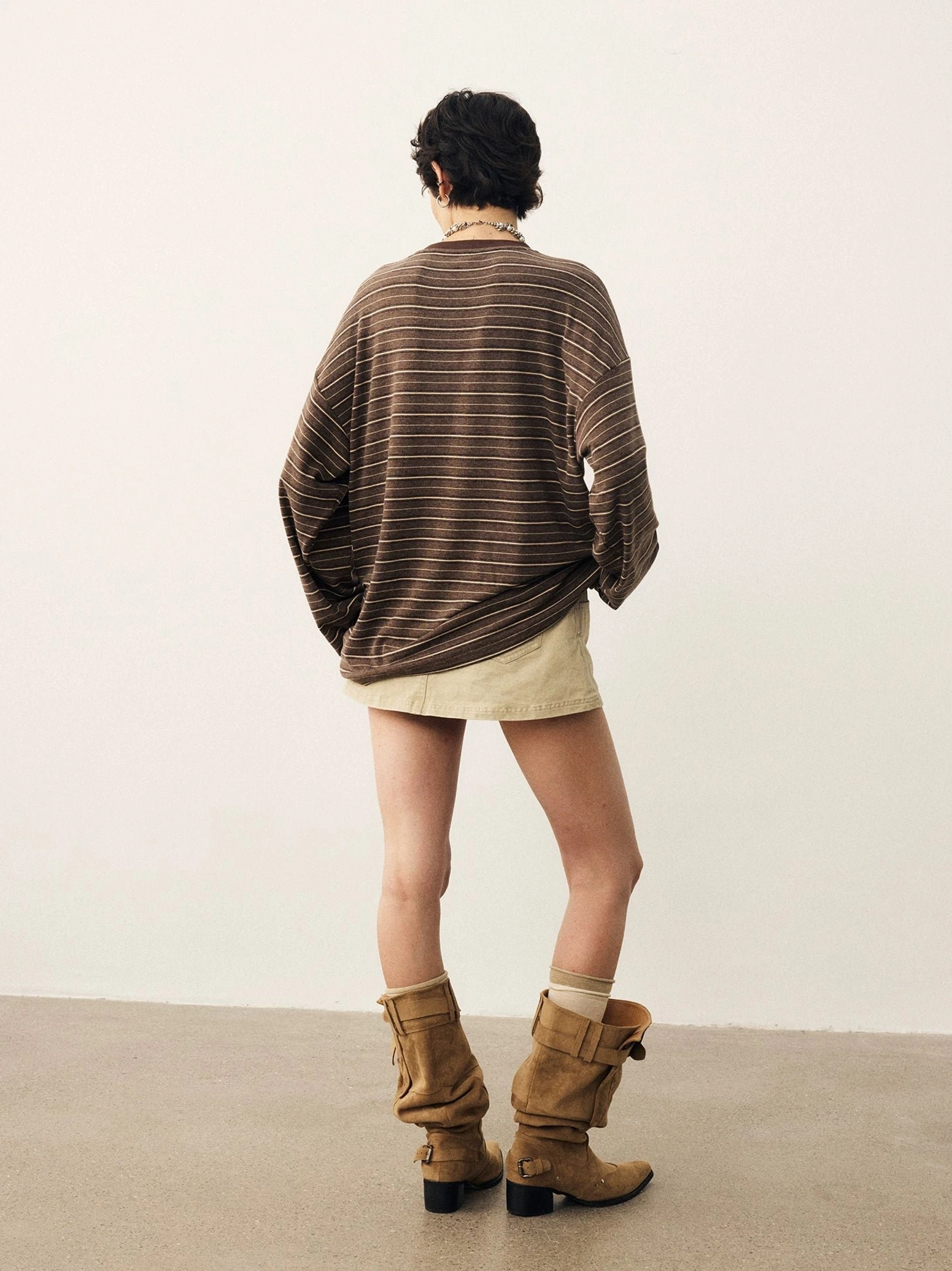 Back view of brown and light striped oversized long sleeve t-shirt with clean unprinted back