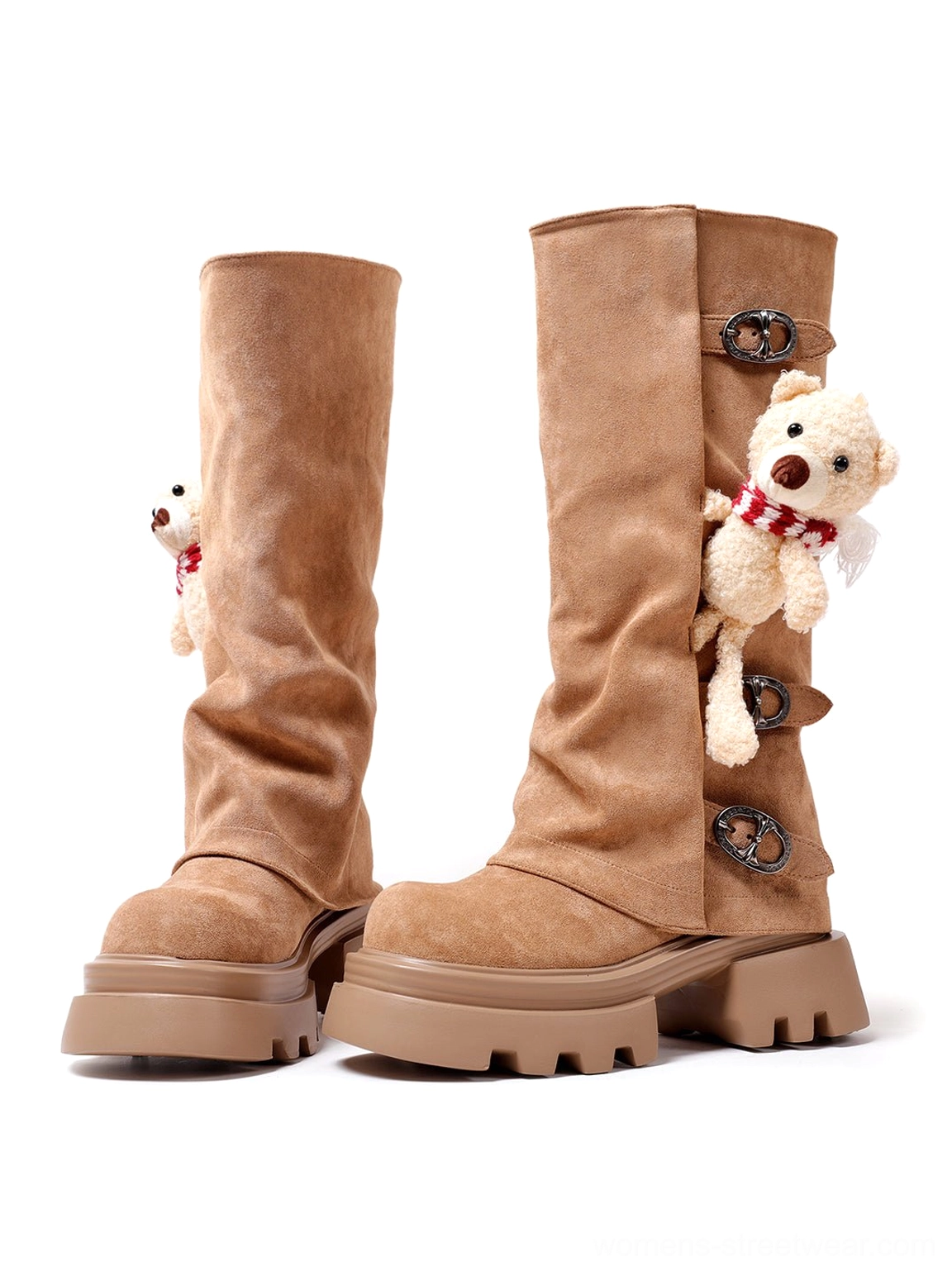 Front three-quarter view of brown suede-look teddy bear charm boots with triple metal buckles and lug soles