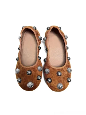 Pair of brown suede-look ballet flats with symmetrical mixed studs and classic rounded ballet silhouettes on a white background