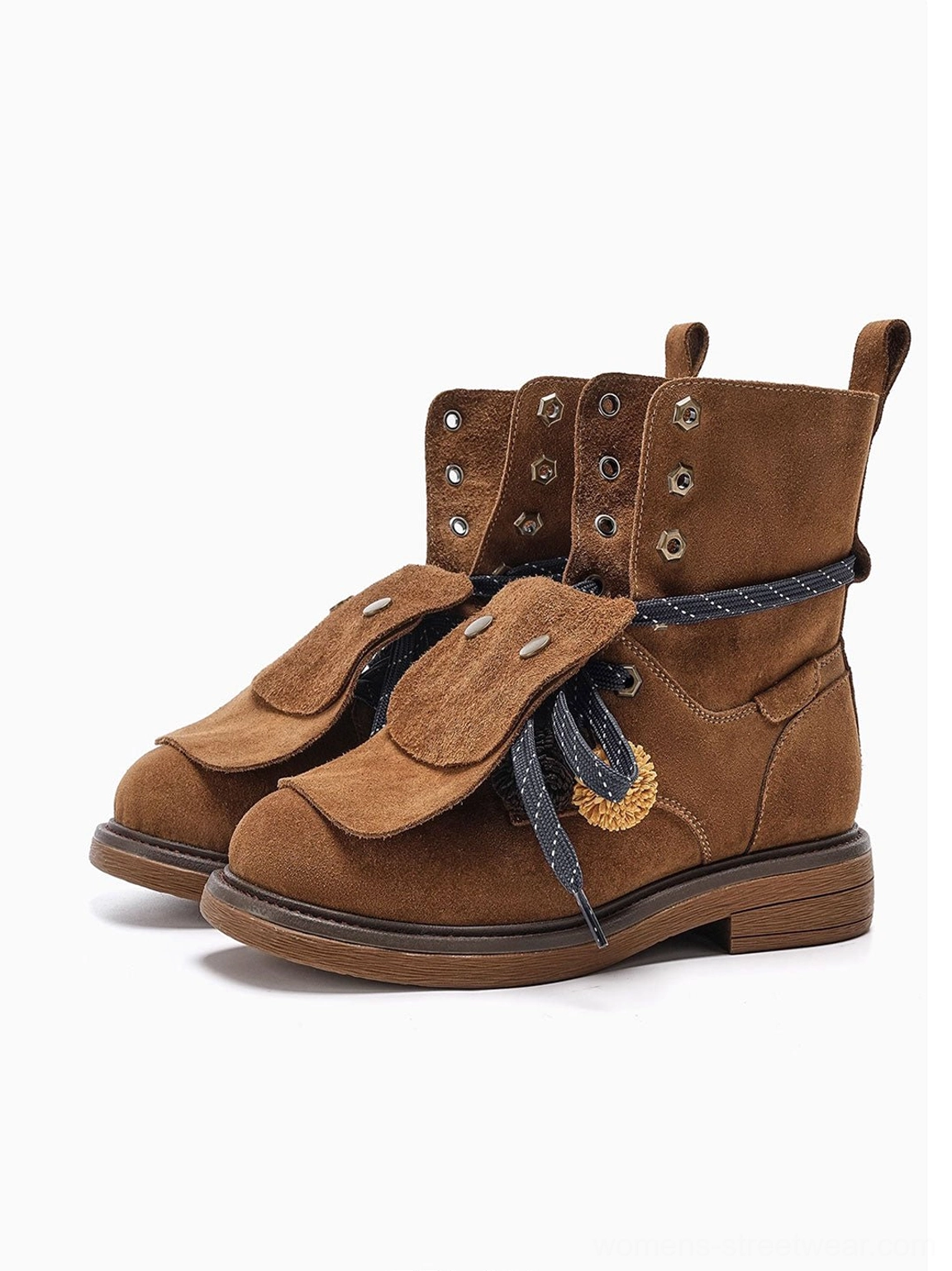 Paired brown suede-look lace-up ankle boots with decorative foldover flaps and braided tassels shown against a clean white background