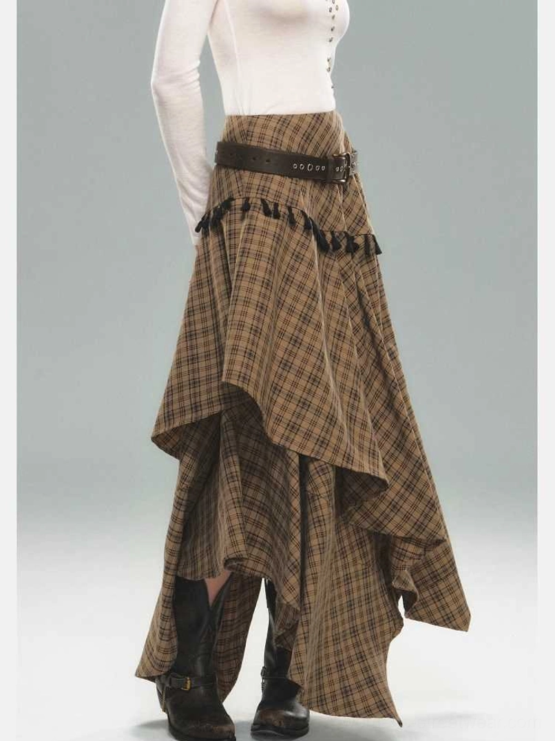 Side rear view of a brown tartan asymmetric tassel skirt showing the draped uneven hem, textured black trim, and streetwear silhouette