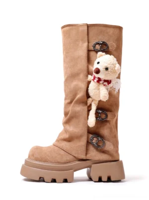 Brown teddy bear charm mid-calf boots with triple buckle straps and chunky lug platform soles