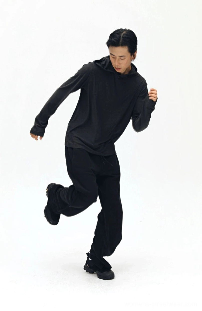 Brown twill sweatpants full length side view - showing twisted bone seam line and leg silhouette
