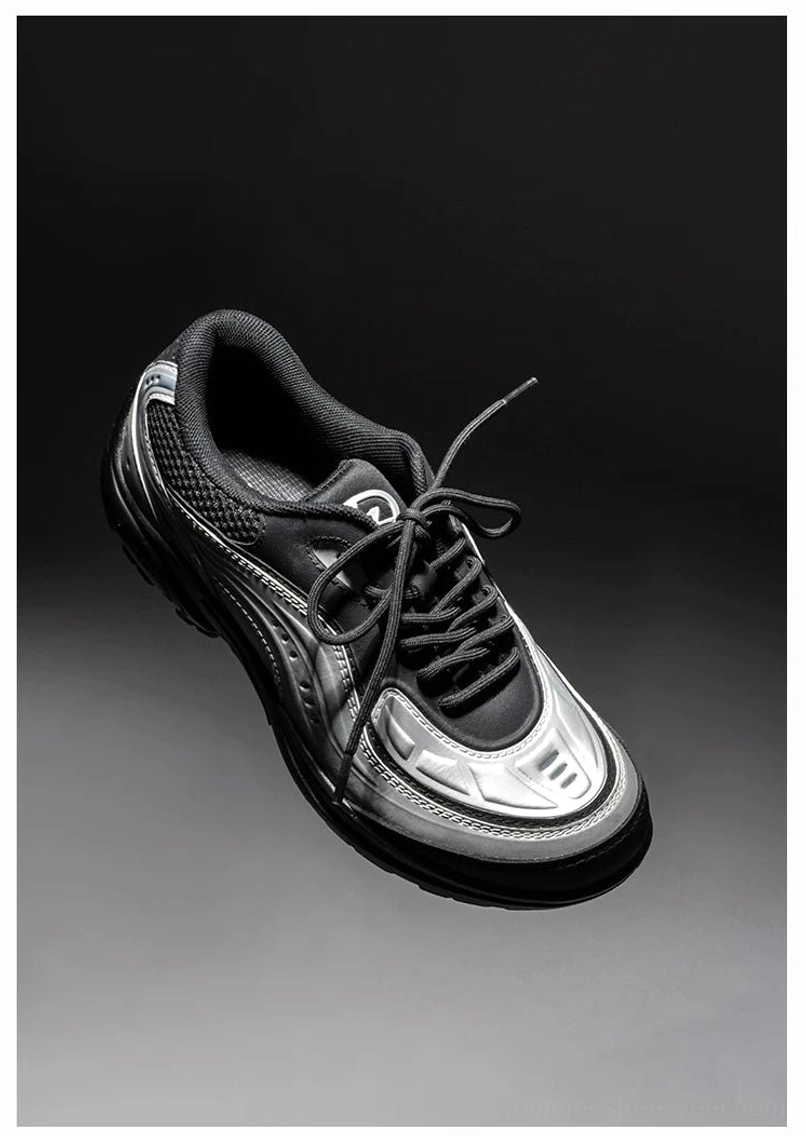 Brushed silver and black futuristic retro tech sneaker top three-quarter view with breathable mesh and streamlined athletic silhouette