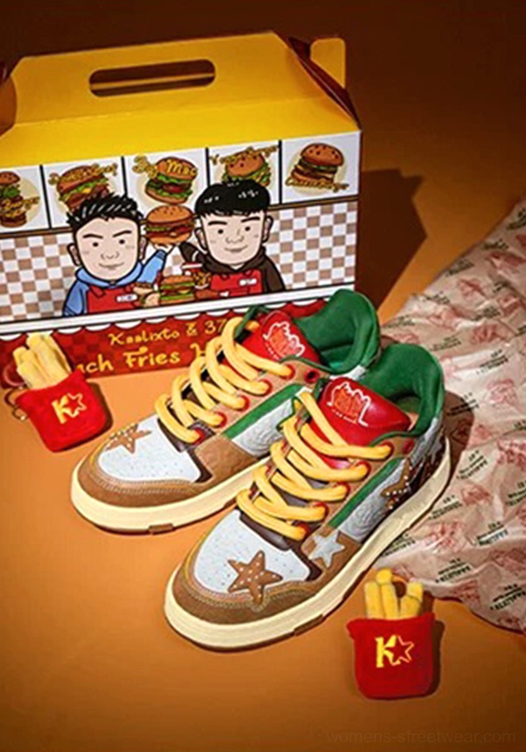 Pair of Burger Star low-top skate sneakers displayed with hamburger packaging and mini fries bucket props