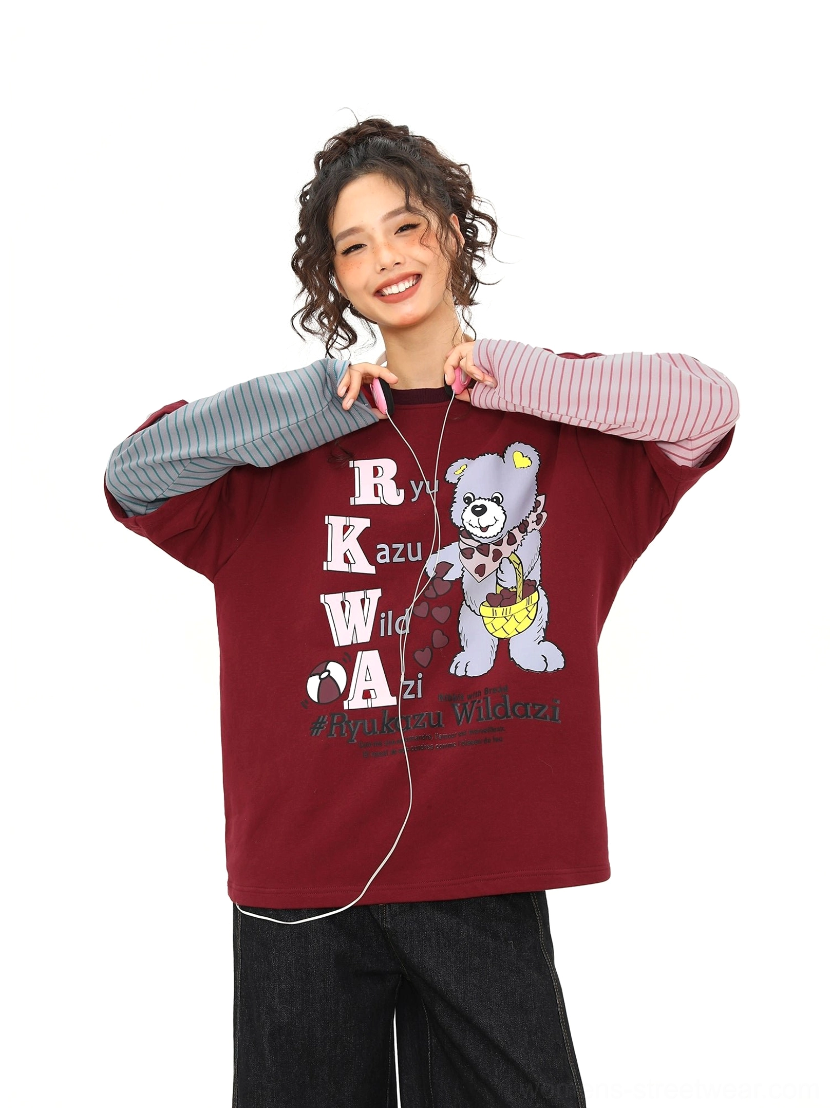 Close front view of a burgundy cartoon bear graphic tee with sewn-in two-tone striped sleeves and retro Y2K lettering
