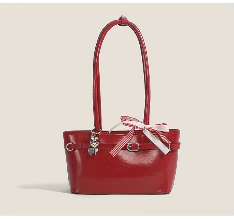 Cherry picnic ribbon baguette bag in burgundy with silk scarf accent, compact underarm silhouette, and feminine streetwear design