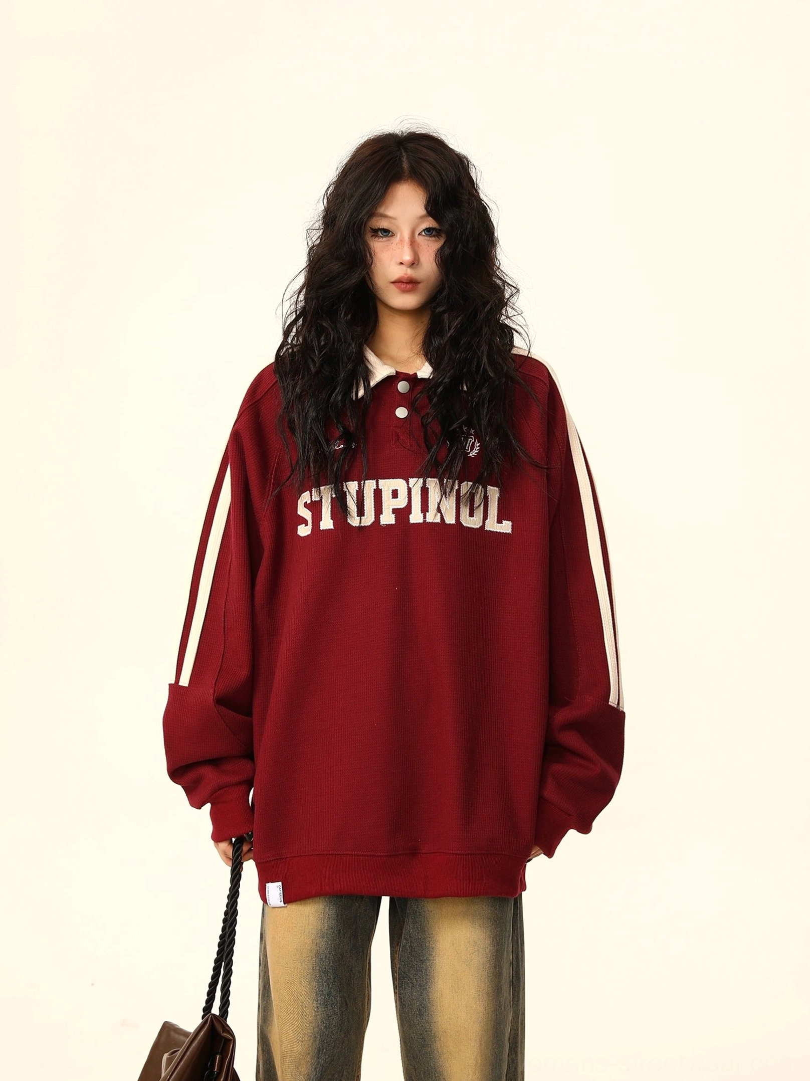 Burgundy red oversized varsity polo sweatshirt with white collar and sleeve stripes styled for Korean preppy streetwear