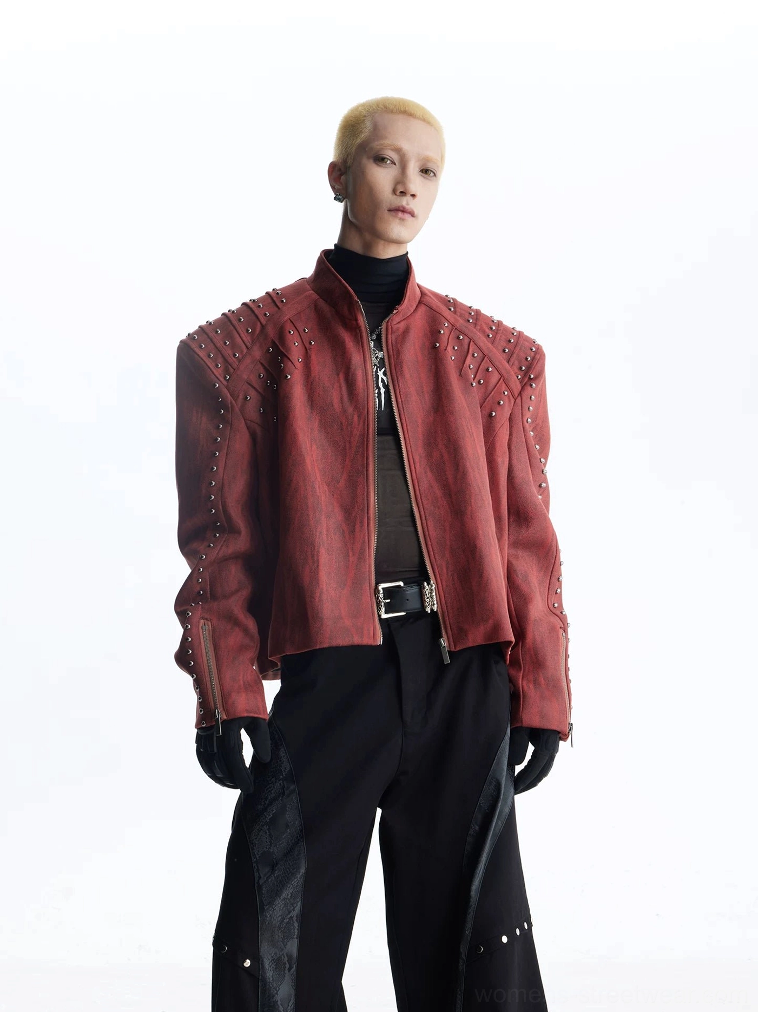 Burgundy red studded moto jacket detail with smooth PU finish structured paneling and statement shoulder hardware