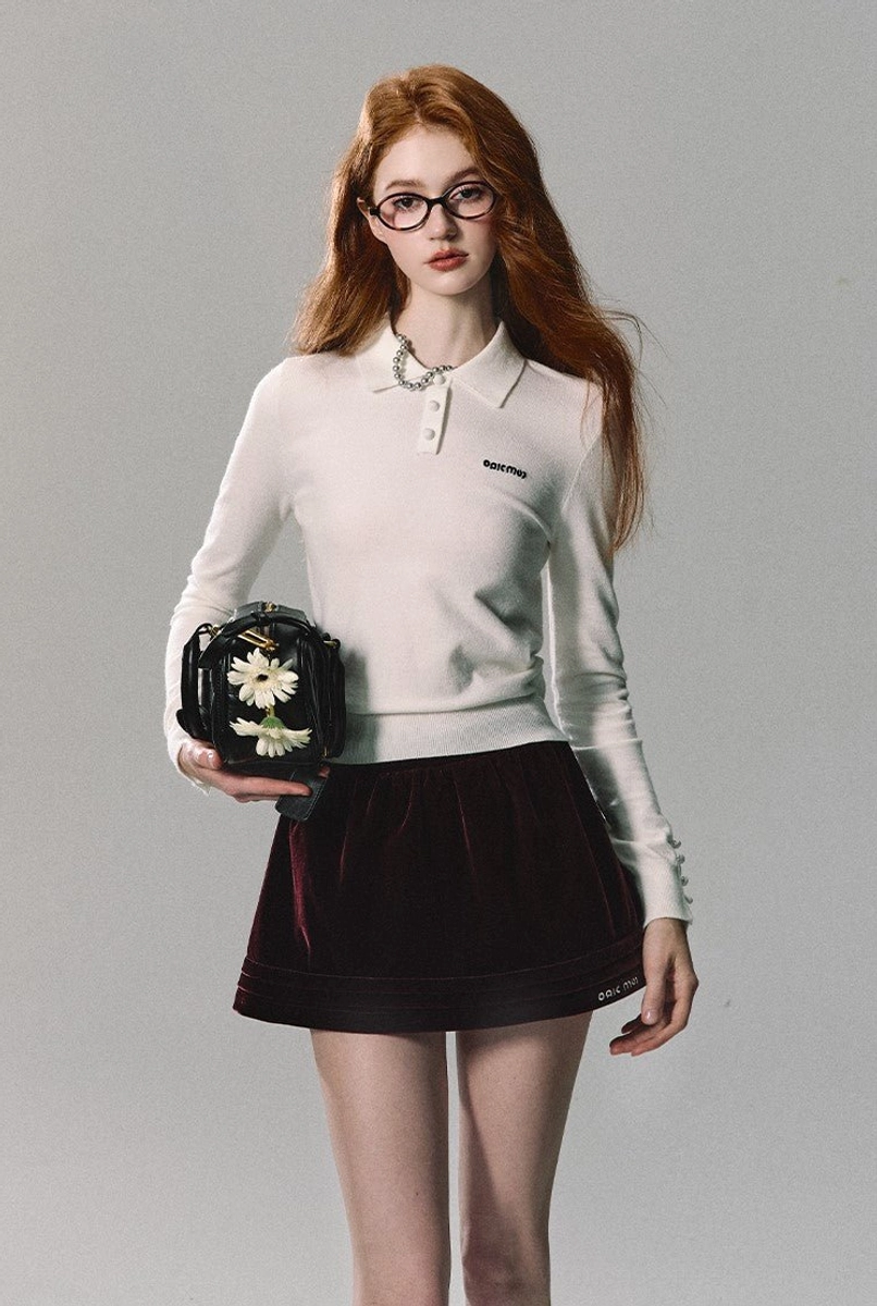 Burgundy red velvet pleated mini skirt with soft sheen and versatile streetwear silhouette for women