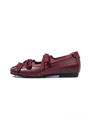 Burgundy ribbon lace-up ballet flats for women in a side front studio product view