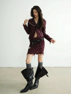 Burgundy sequin blazer and low-rise distressed mini skirt full outfit with black western boots and layered silver chains