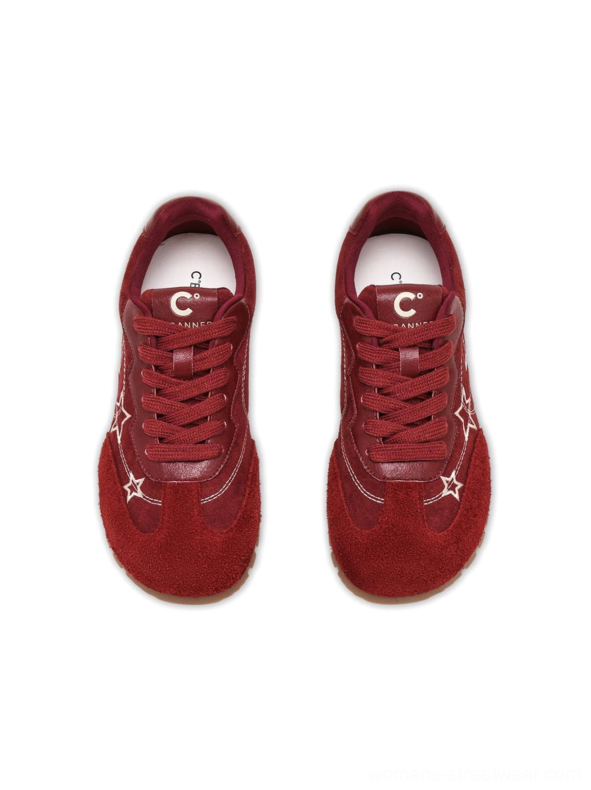 Flat lay front view of burgundy star embroidered low-top streetwear sneakers with white laces and gum soles