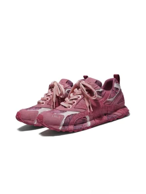 Pair of burgundy urban camo runner sneakers shown from a front three-quarter angle with matching laces and heel pull tabs