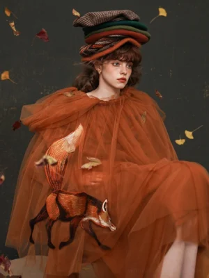Close front view of burnt orange fox embroidered sheer tulle strap midi skirt with layered vintage streetwear styling
