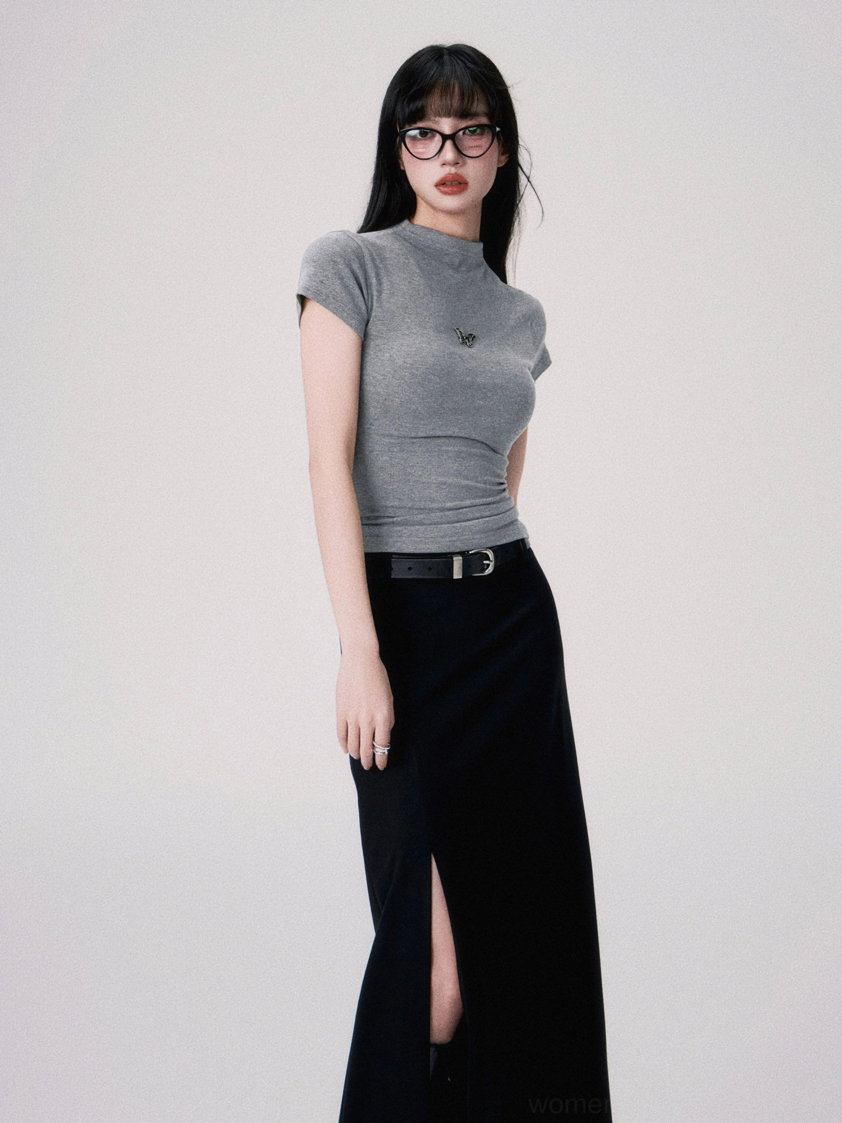 Heather gray butterfly embroidered fitted crop tee styled with a high slit black maxi skirt and leather belt