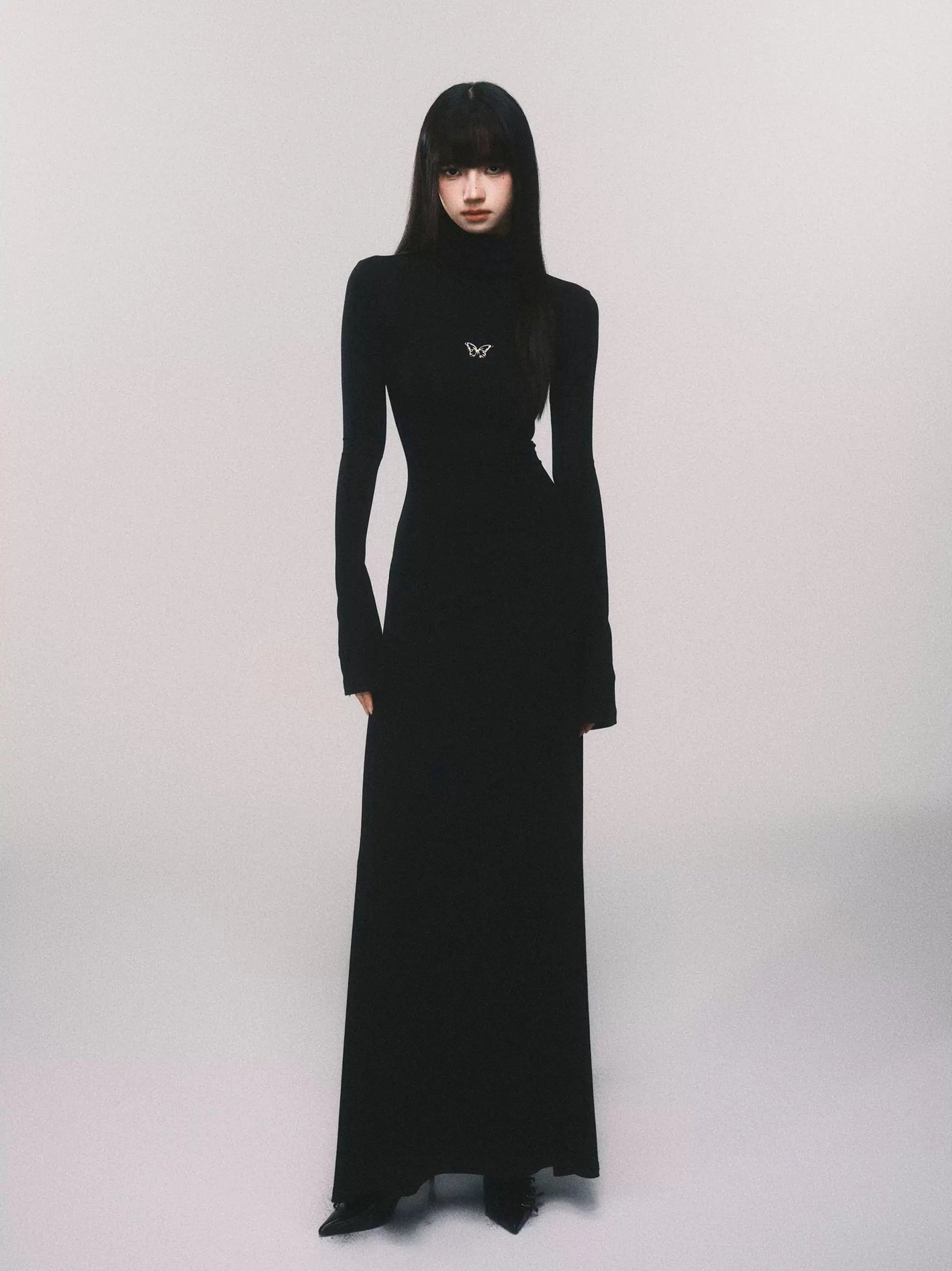 Black butterfly turtleneck bodycon knit maxi dress with long sleeves and floor-length slim silhouette