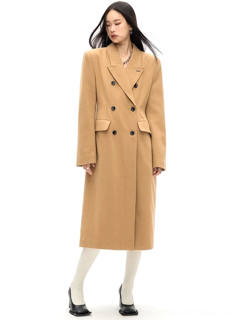 Camel brown tailored wool long coat in three-quarter view with notched lapel and double-breasted closure