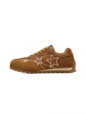 Side profile of camel suede-look star embroidered retro low-top sneakers with white star detail and classic lace-up closure