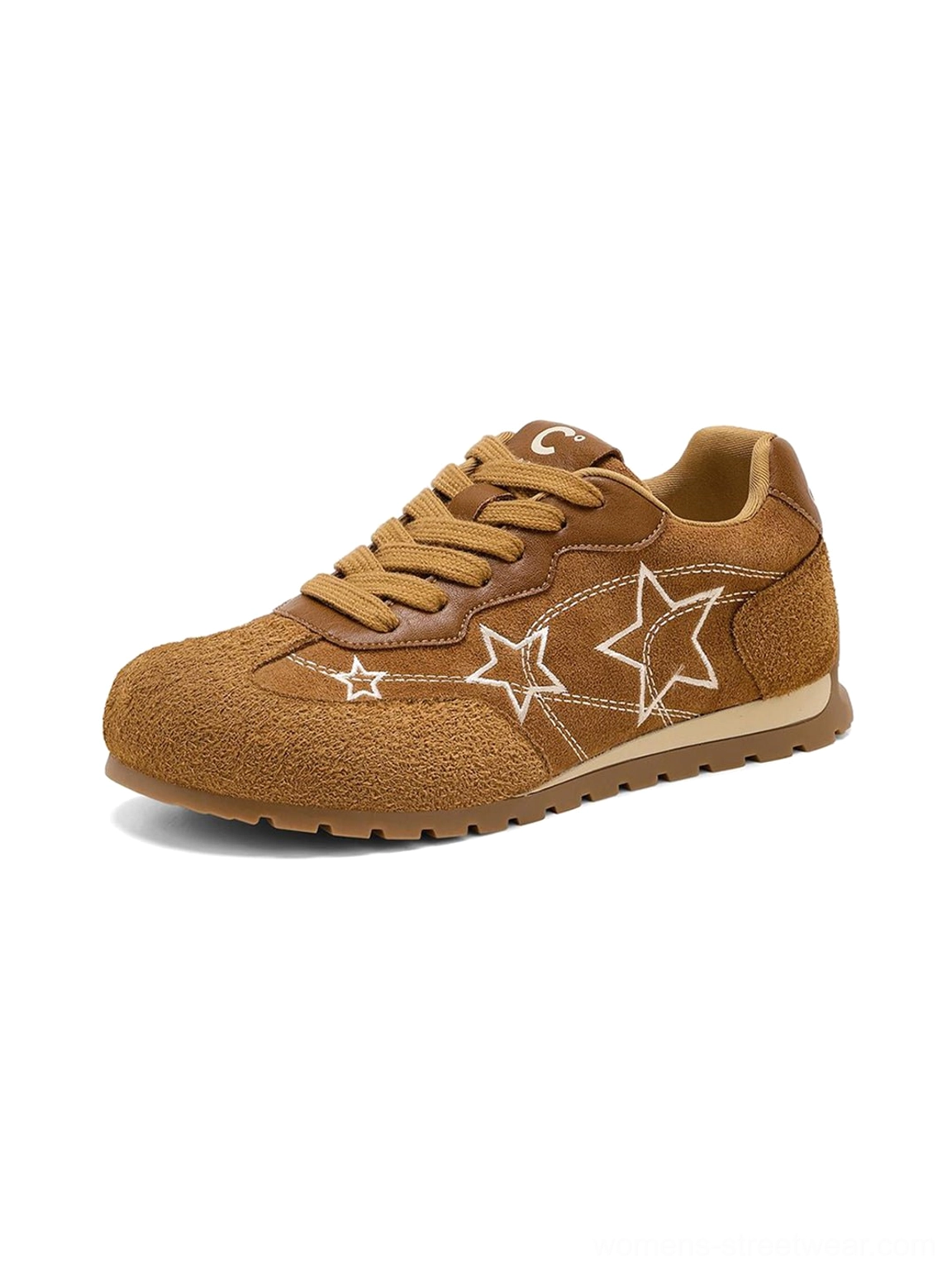 Front three-quarter view of camel tone retro sneakers with multiple white star patterns round toe and suede-look finish