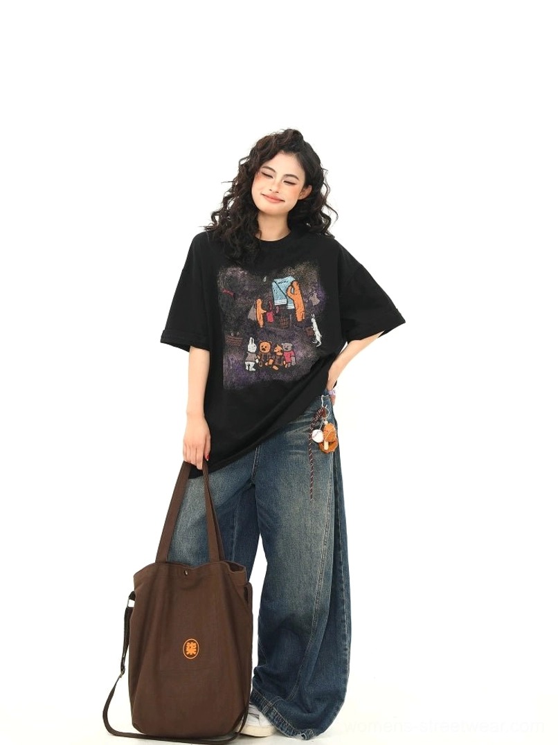 Side view of relaxed black oversized campfire bear graphic T-shirt showing loose dropped-shoulder streetwear fit