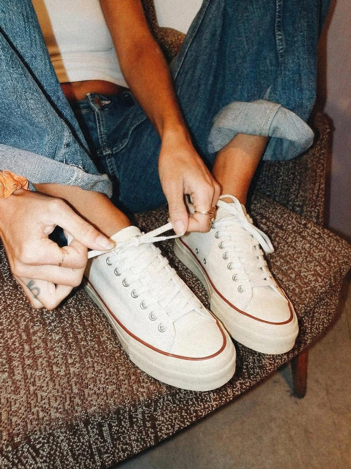 Close-up detail of canvas upper and cork midsole junction on platform sneaker, showing construction quality and material