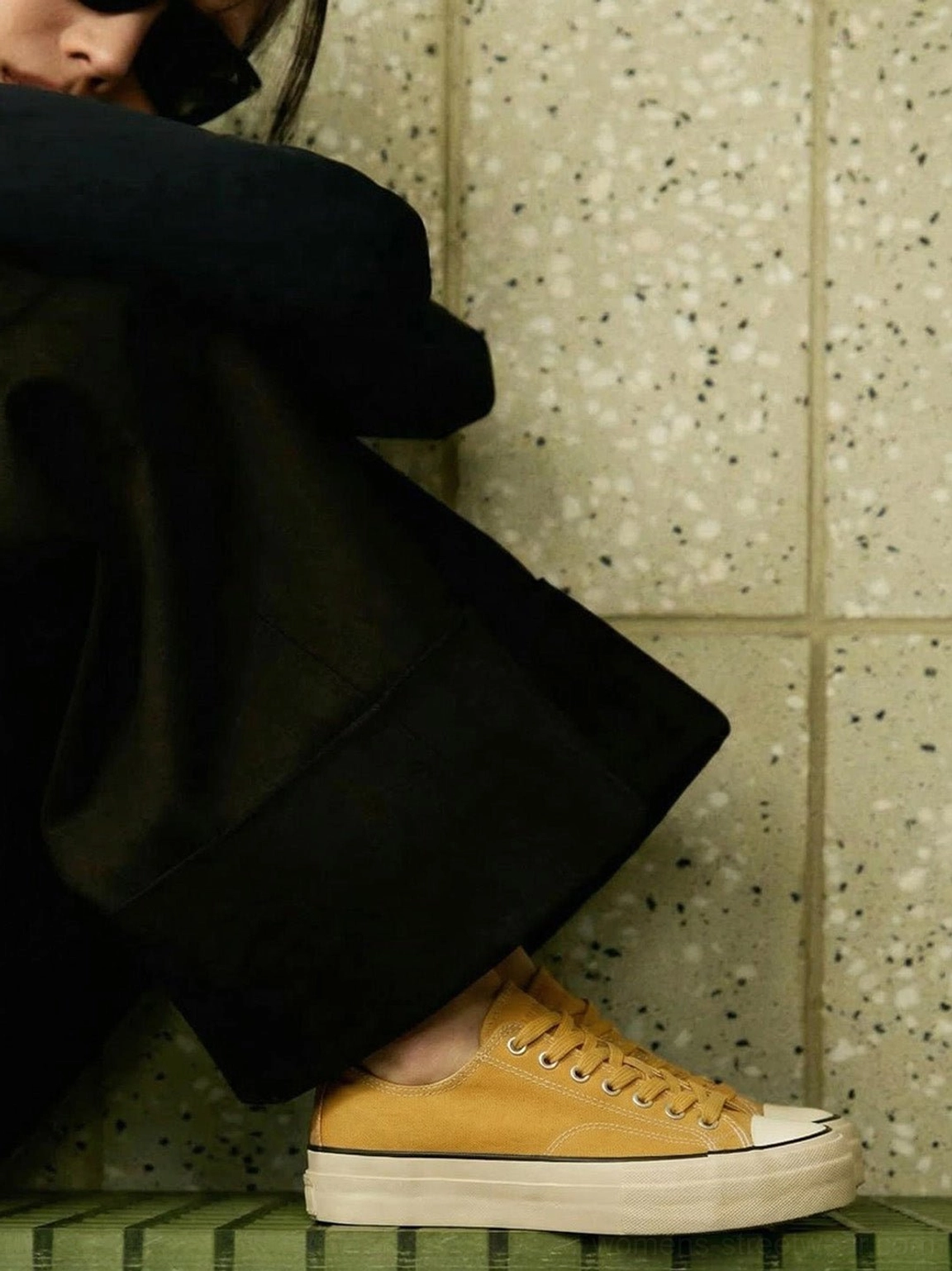 Canvas low-top platform sneaker with cork midsole in Gorpcore aesthetic outfit with technical clothing and accessories