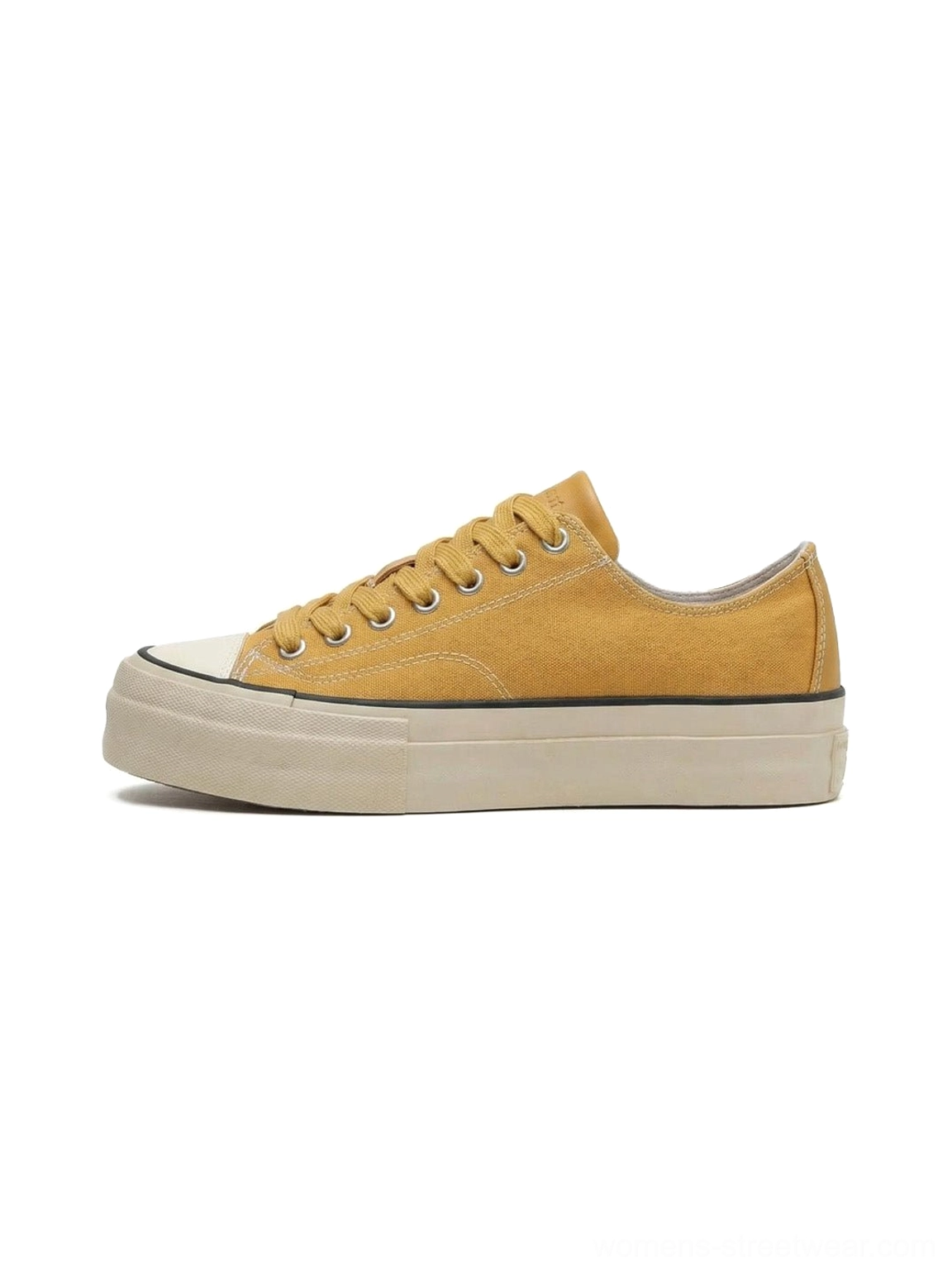 Canvas platform sneaker with cork midsole in context of street culture and skate park aesthetic styling