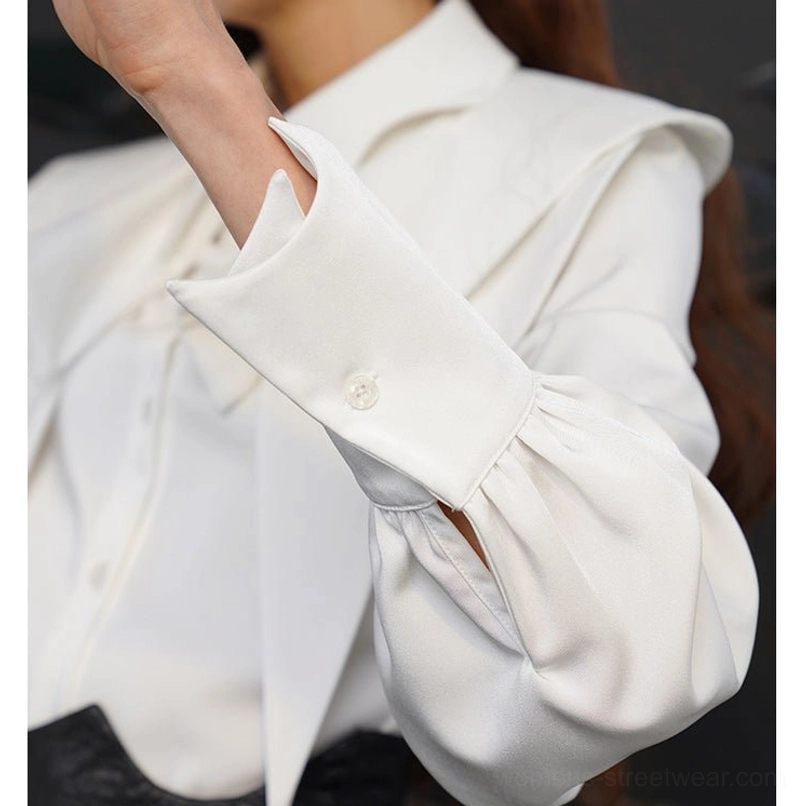 Cape-inspired layered ruffle blouse with fox charm detail for dark botanical and avant garde streetwear looks