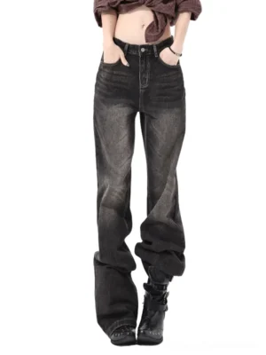 Carbon brown low-rise wide-leg jeans in faded charcoal denim shown from the front with classic pockets and a relaxed streetwear silhouette