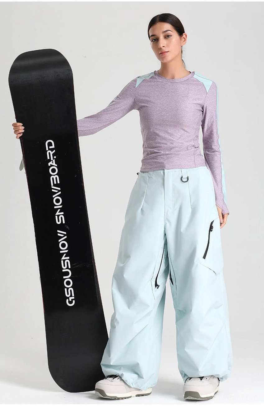 Wide-leg cargo snow pants thigh pocket utility design functional storage skateboard culture aesthetic