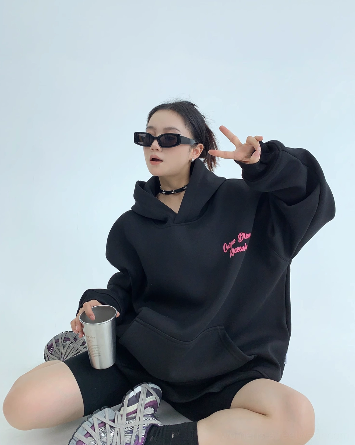 Black Carpe Diem oversized streetwear hoodie featuring bright pink script lettering
