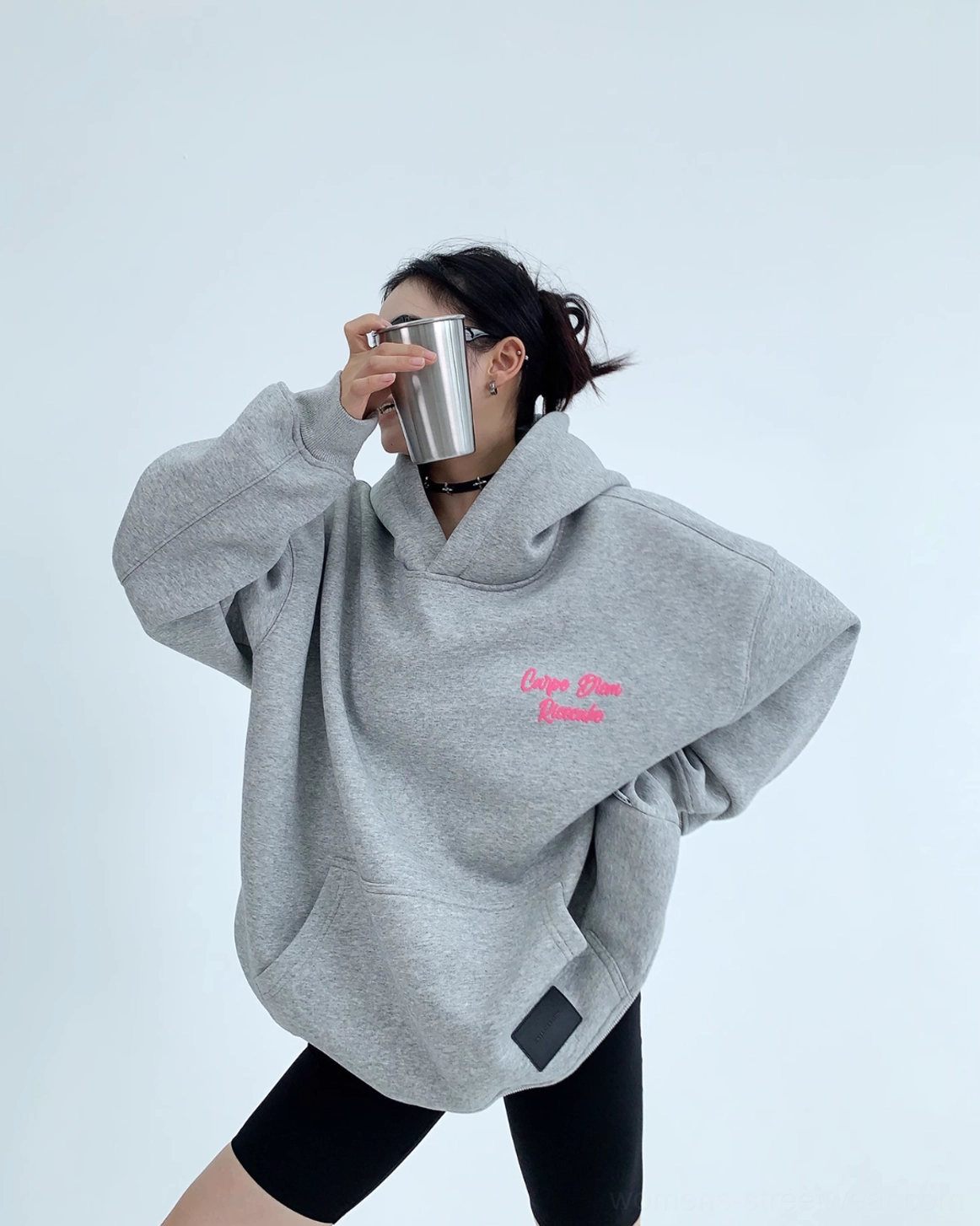 Front three-quarter view of heather gray Carpe Diem pink script oversized hoodie with kangaroo pocket