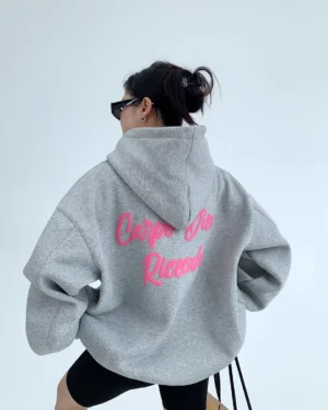 Heather gray Carpe Diem pink script oversized streetwear hoodie shown from the back in a white studio