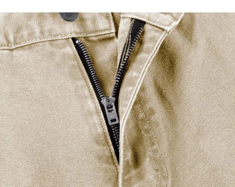 Carpenter denim pants front closure close-up showing metal zipper fly, waistband button, and workwear construction